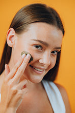 Load image into Gallery viewer, Model apply Terra Prima Pink Clay Salt Scrub for Face and Body to her face.