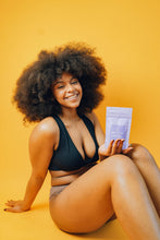 Load image into Gallery viewer, Model holding Terra Calma Lavender Clay Salt Scrub for Face and Body